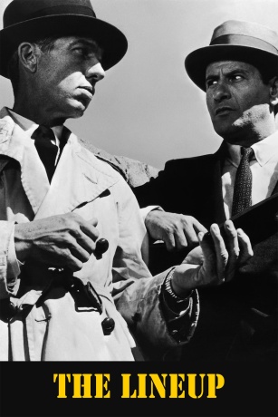 Two men wearing suits looking at each other suspiciously